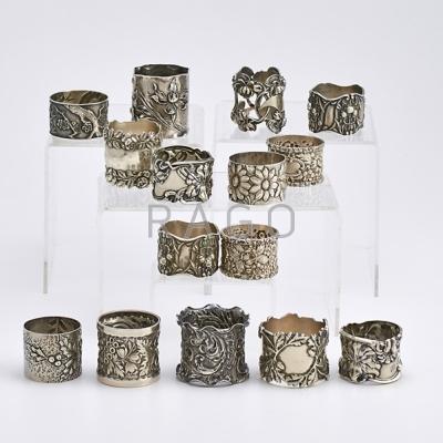 Appraisal: FIFTEEN FLORAL MOTIF SILVER NAPKIN RINGs Japanesque and Art Nouveau