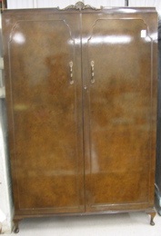 Appraisal: BURL WALNUT VENEER AND MAHOGANY WARDROBE Wrighton Furniture Co England