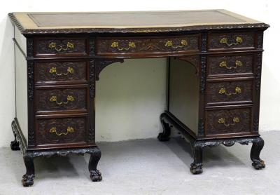 Appraisal: A LATE VICTORIAN MAHOGANY PEDESTAL DESK profusely carved with foliate