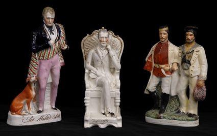 Appraisal: TWO STAFFORDSHIRE POTTERY FIGURES One modeled as Sir Walter Scott