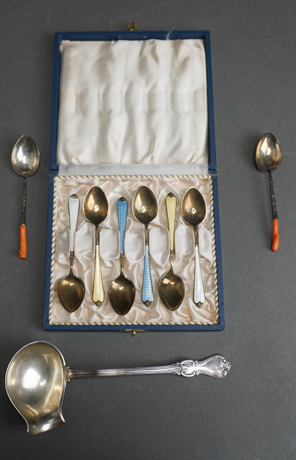 Appraisal: FINNISH SILVER LADLE SIX ENCASED ENAMELED ENGLISH STERLING DEMITASSE SPOONS