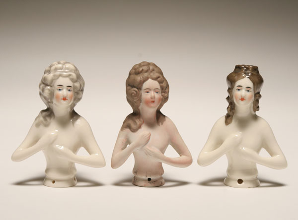 Appraisal: Three hand painted half dolls two porcelain and one bisque