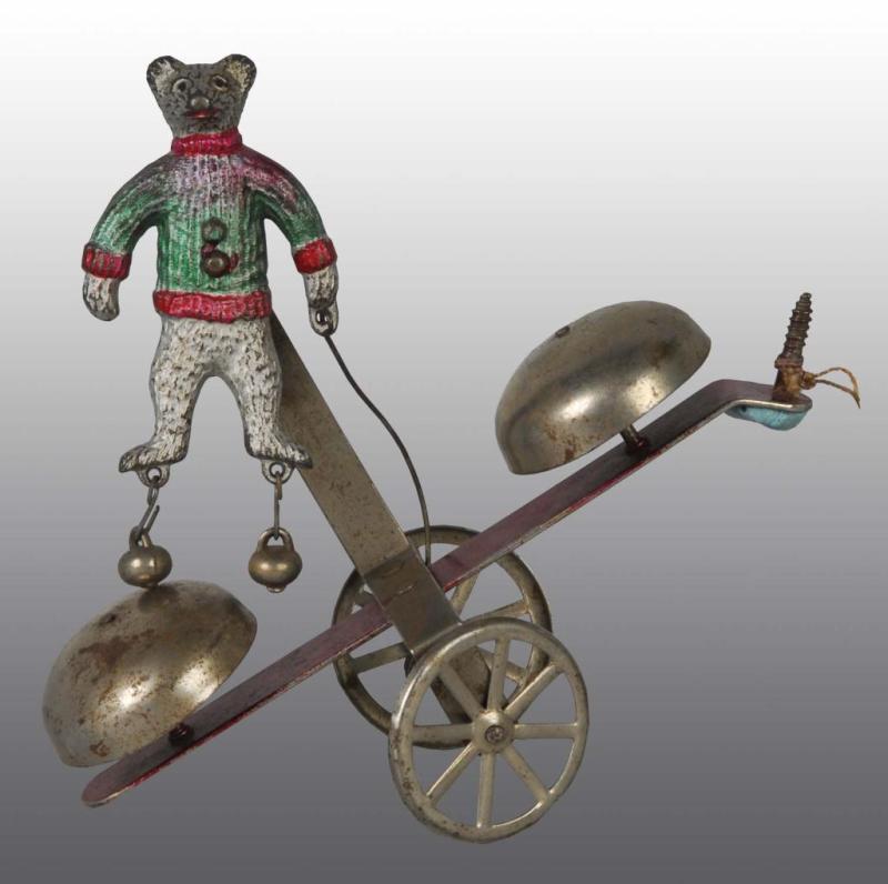 Appraisal: Iron Tin Bear Bell Toy Description American Original bells on