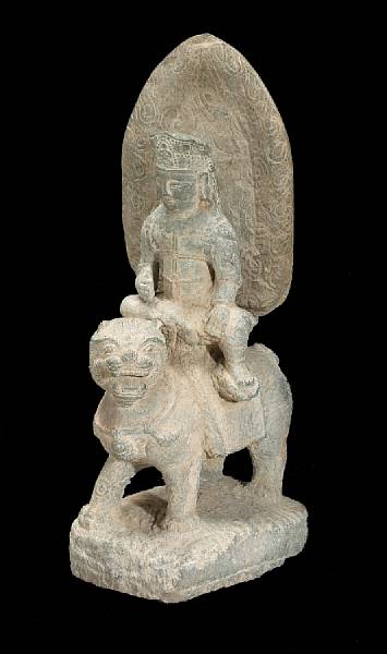 Appraisal: An archaistic carved stone figure of Wenshu on a lion