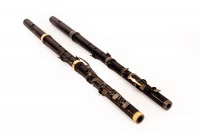 Appraisal: A rosewood -key flute Monzani Co with ivory collars cm