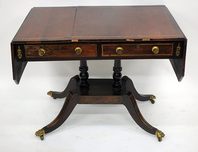 Appraisal: A GEORGIAN ROSEWOOD SOFA TABLE with gilt inlay and mounts