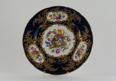 Appraisal: A S vres-style plate painted with panels of flowers and