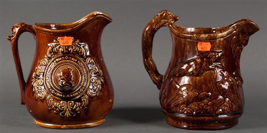 Appraisal: Two American Rockingham type relief molded glazed pottery pitchers second