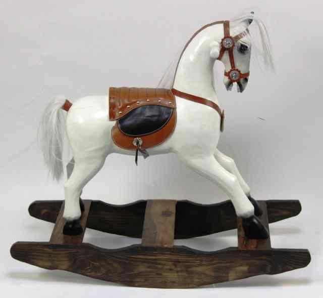 Appraisal: A wooden rocking horse on a bow rocker cm long