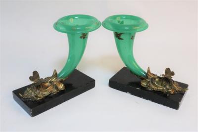 Appraisal: A pair of green glass cornucopia shaped vases issuing from