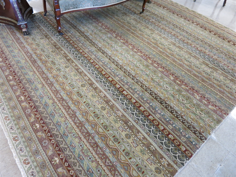 Appraisal: AN UNUSUAL BORDERLESS ORIENTAL CARPET Indo-Persian featuring a variety of