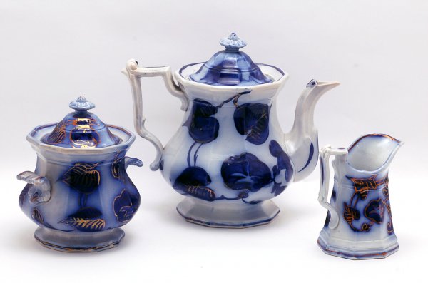 Appraisal: Flow blue coffeepot creamer and covered sugar ribbed bodies decorated