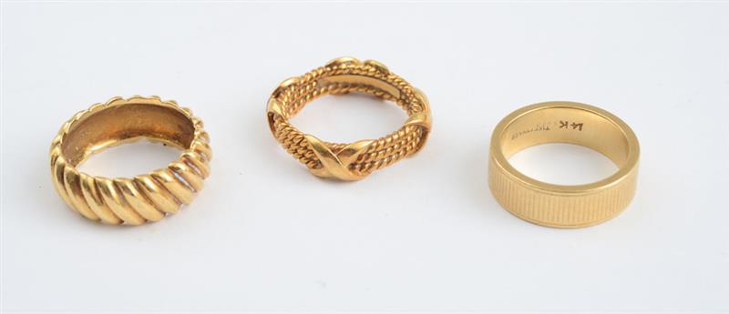 Appraisal: THREE GOLD WEDDING BANDS TIFFANY CO Two k and one