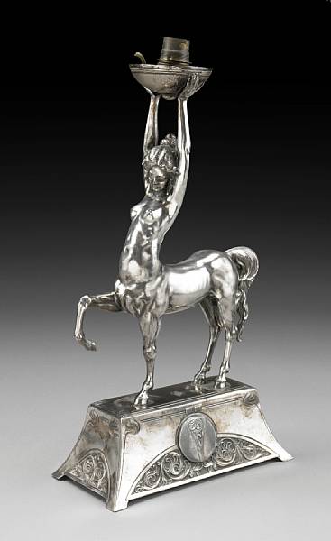 Appraisal: A Continental Art Nouveau silvered metal figural candlestick circa Now