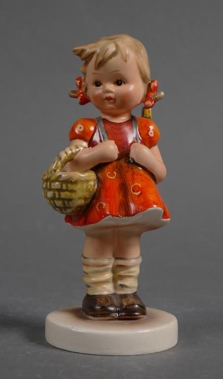 Appraisal: Hummel School Girl This piece has a vivid orange skirt