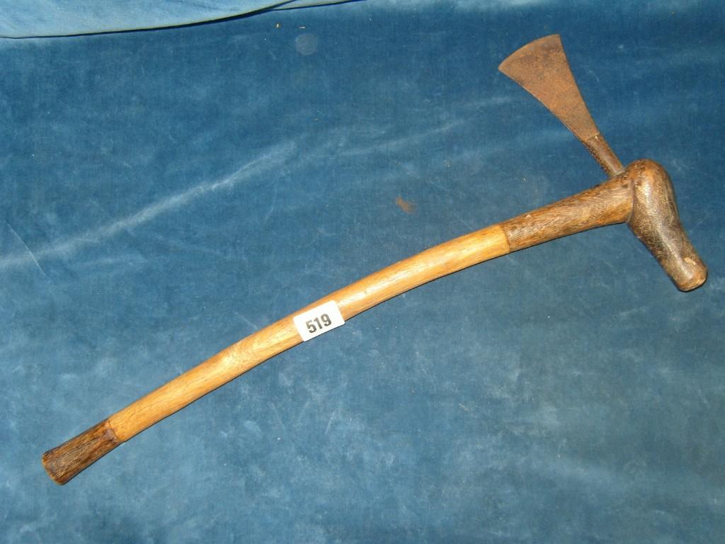 Appraisal: An ethnic wooden and iron axe