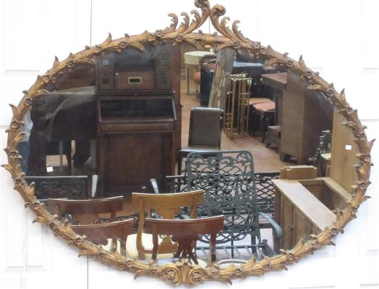 Appraisal: MIRROR An oval gilt French style mirror having a scrolled