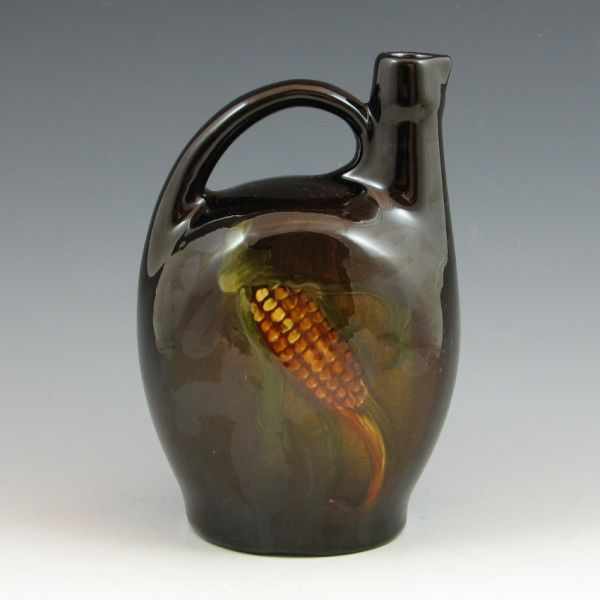 Appraisal: Owens Utopian standard glaze jug with corn Marked Owens Utopian