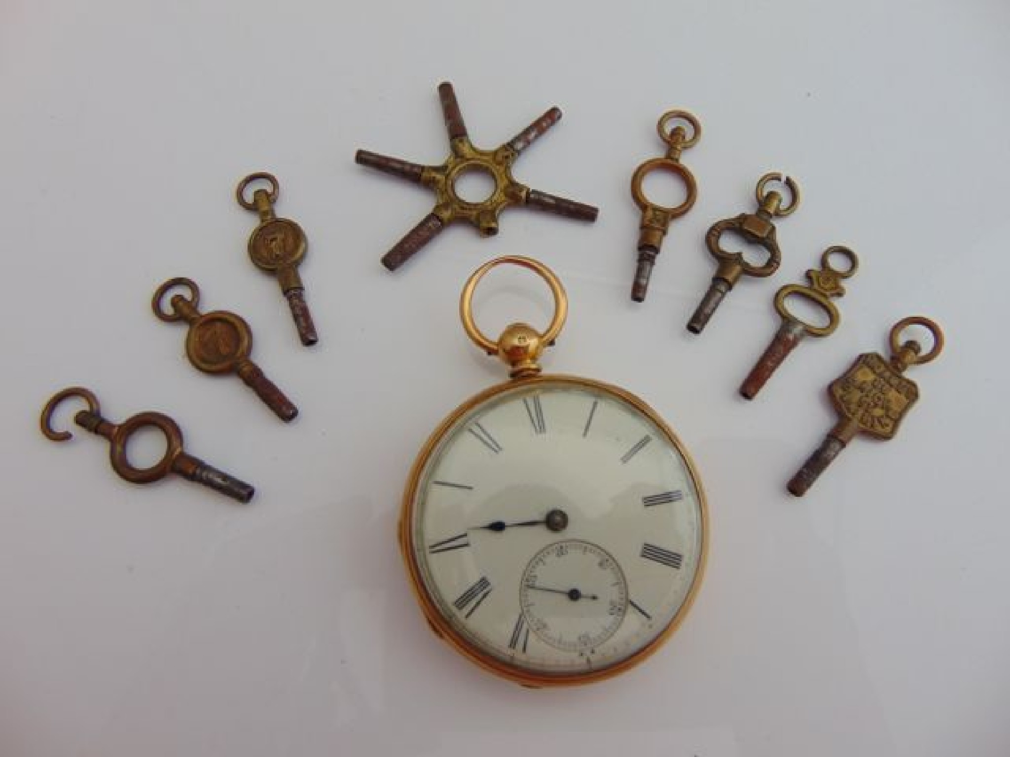 Appraisal: An ct gold open-faced pocket watch the white enamelled dial