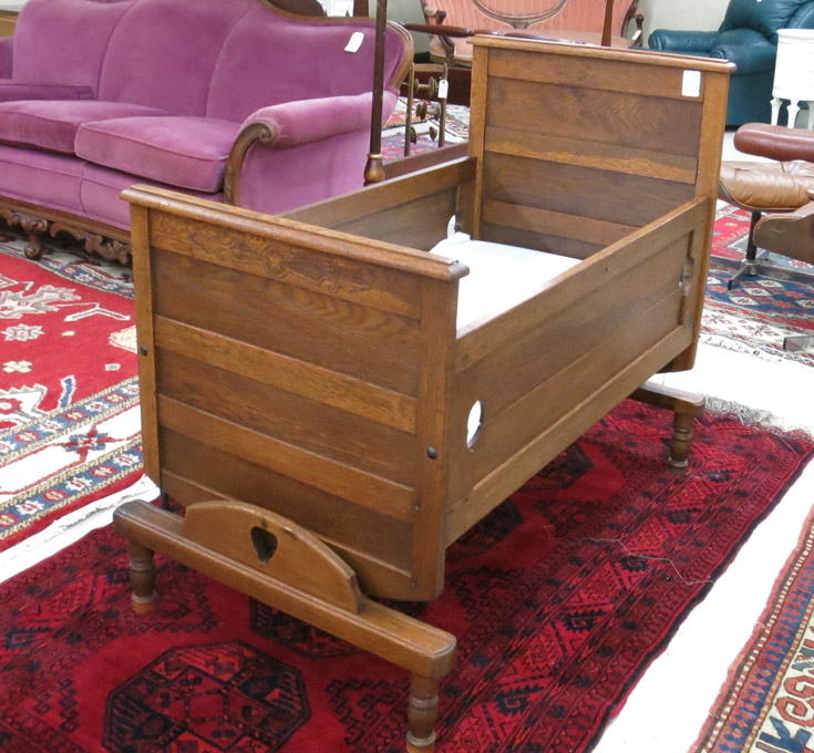 Appraisal: LATE VICTORIAN OAK ROCKING CRIB American patent dated Feb on