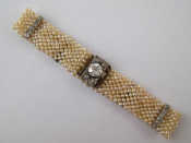 Appraisal: An Edwardian seed pearl bracelet with diamond set spacers and