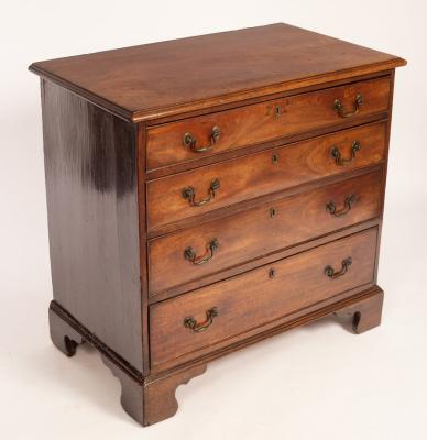 Appraisal: A George III mahogany chest fitted four long drawers on