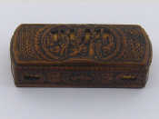 Appraisal: A treen box with integral box hinge carved with fishscale