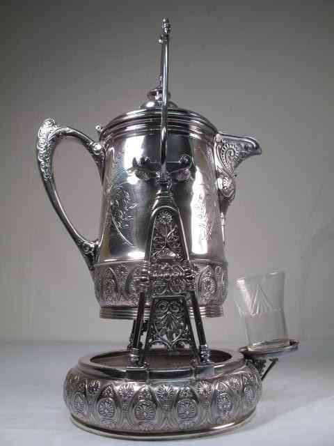 Appraisal: Victorian silverplated water pitcher on stand Marked ''Middletown quadruple plated''