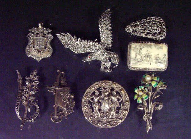 Appraisal: Assorted silver enamel brooches and a silver medal