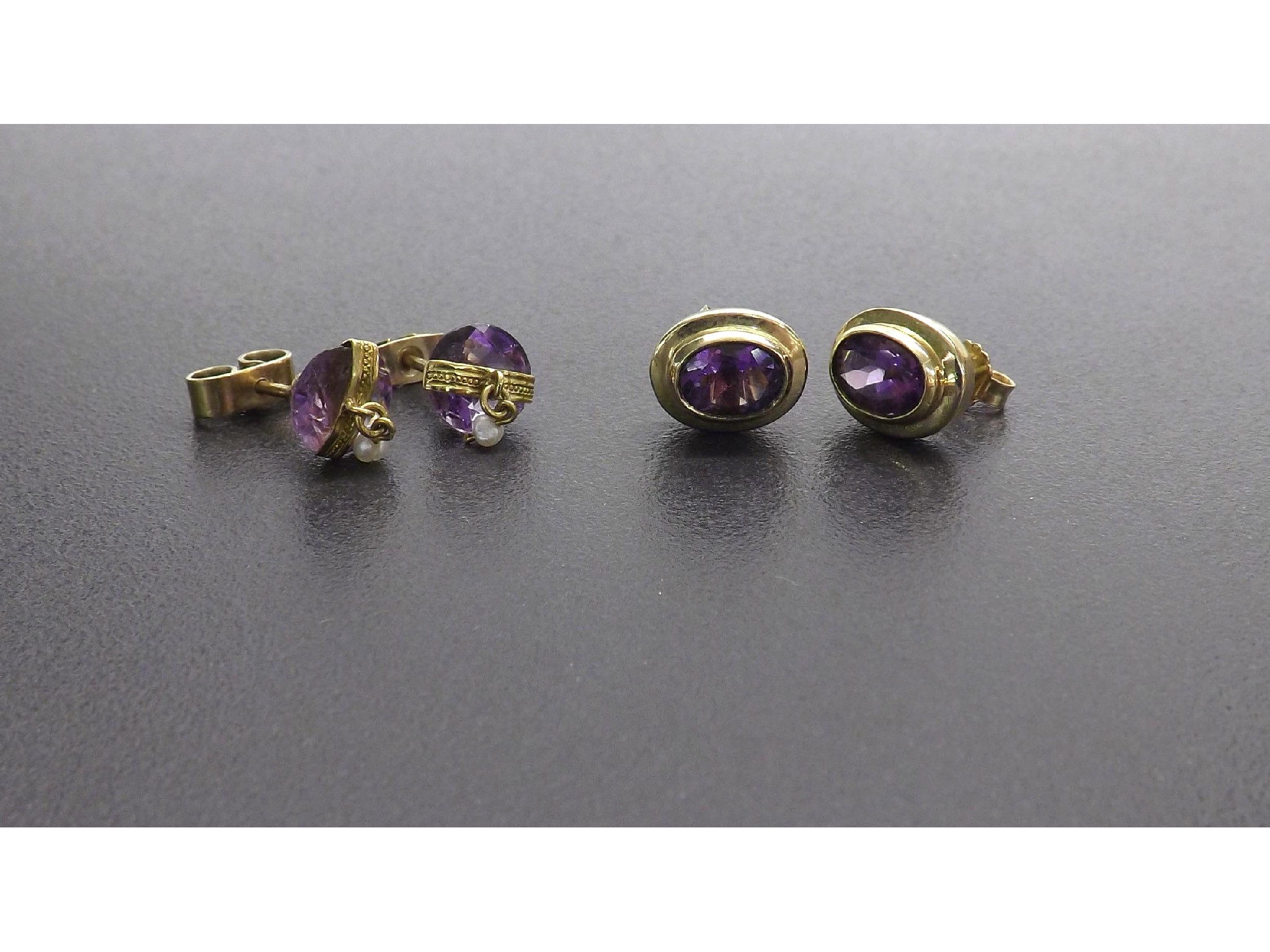 Appraisal: Pair of ct yellow gold oval amethyst ear studs mm