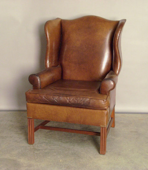 Appraisal: Wing back chair in brown leather with marlborough legs Provenance