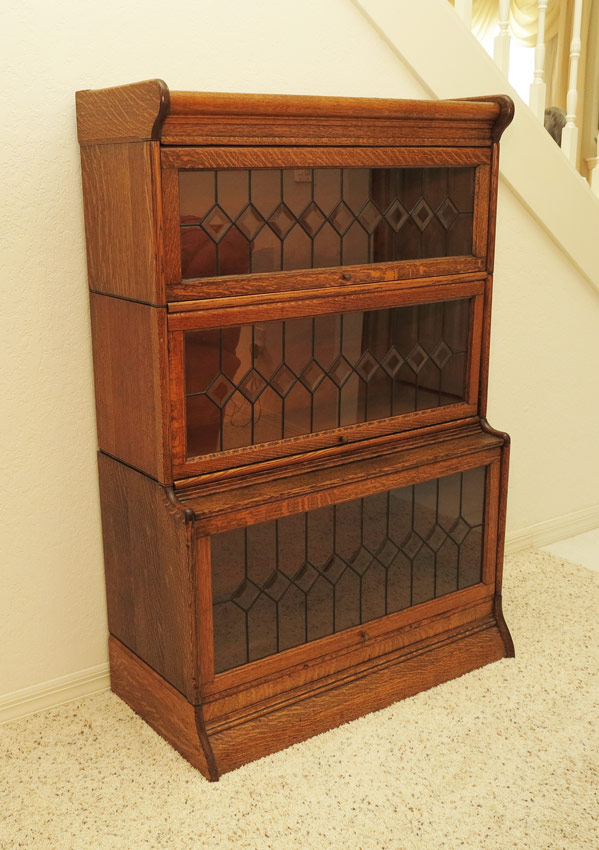 Appraisal: LEADED GLASS GOLDEN OAK BARRISTER BOOKCASE stacking sections with base