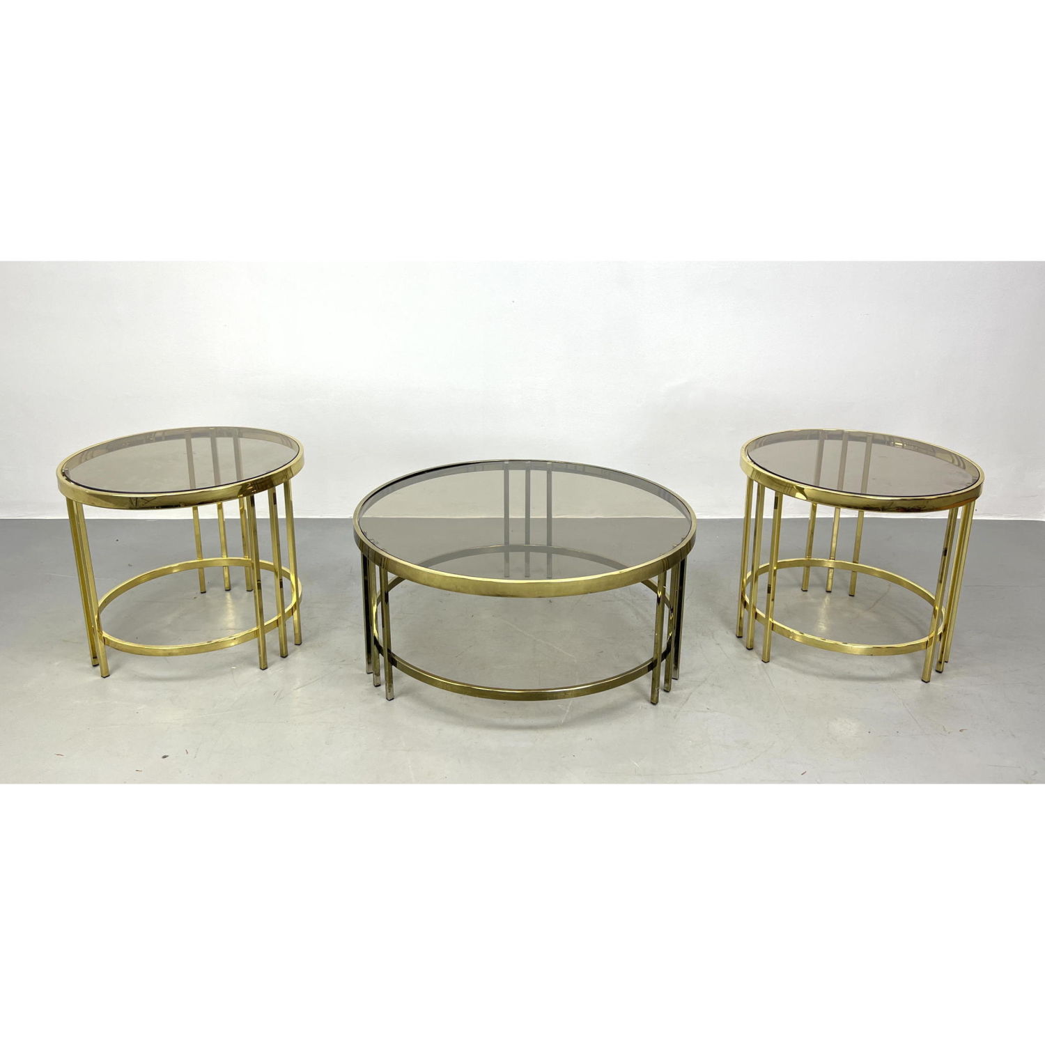 Appraisal: pc Modernist Brass Tone Glass Coffee Side Tables DESIGN INSTITUTE