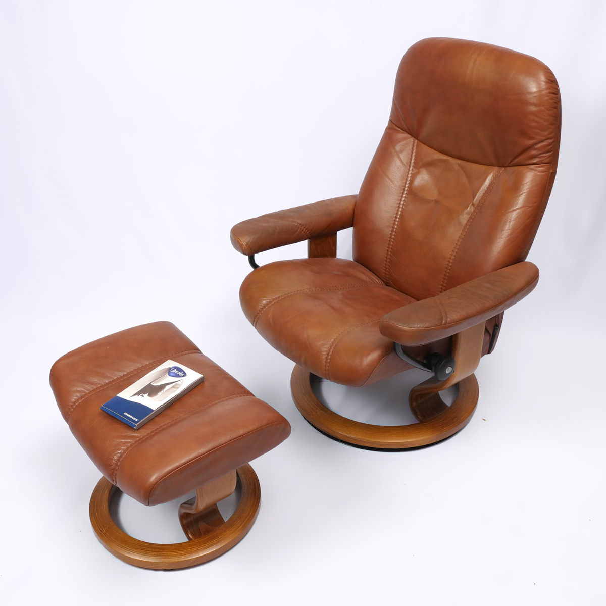 Appraisal: EKORNES FOOTSTOOL AND CHAIR Ekornes brown leather Stressless recliner foot