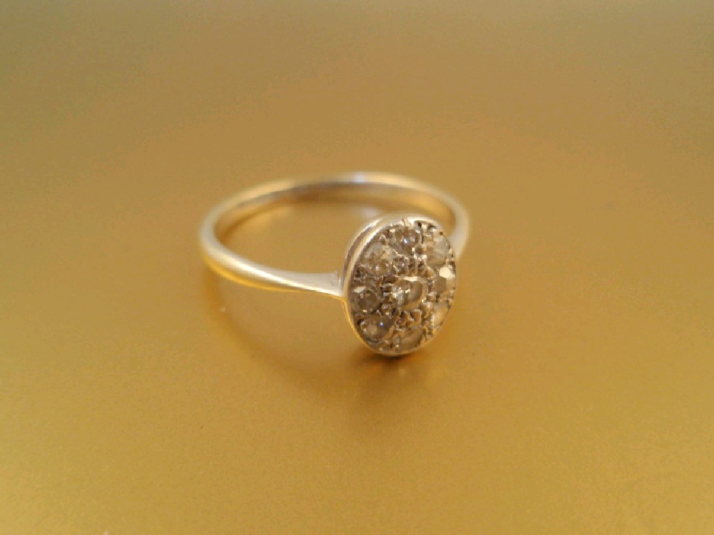 Appraisal: An Art Deco style oval head diamond set ring the