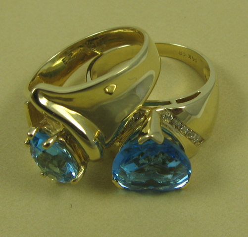 Appraisal: TWO BLUE TOPAZ RINGS both with K yellow gold settings