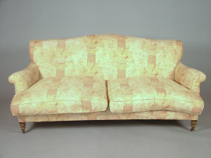 Appraisal: A Victorian two seater sofa with floral and pillar upholstery