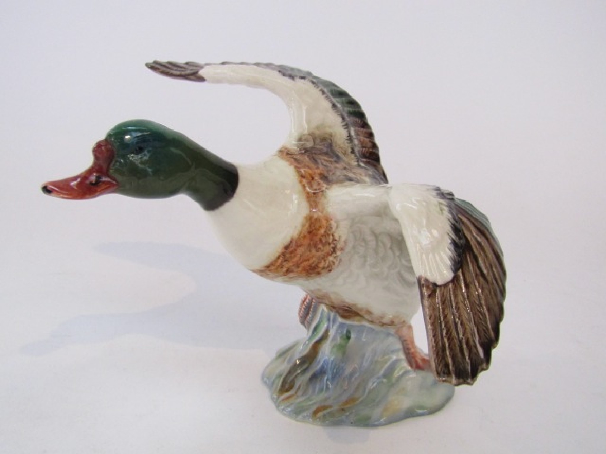 Appraisal: A Beswick model of a shelduck with impressed number to