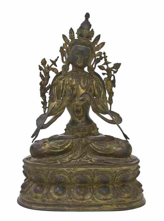 Appraisal: A Bronze Model of a Buddhist Deity the figure depicted