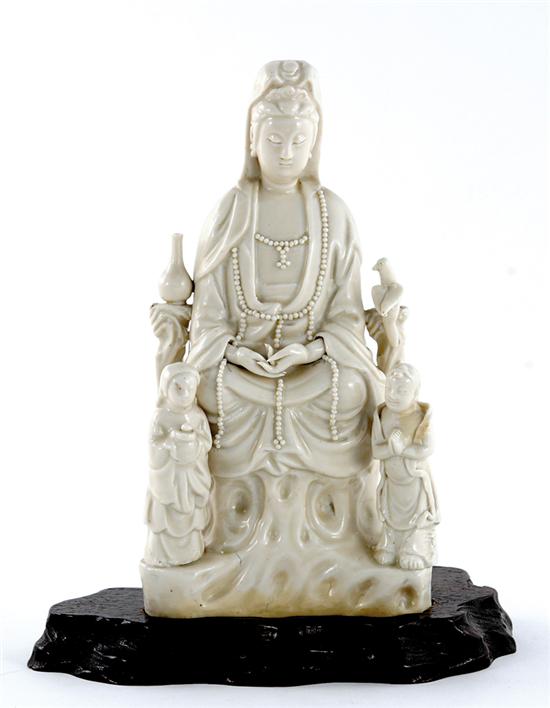 Appraisal: Chinese Export blanc-de-chine Guanyin th century seated deity flanked by