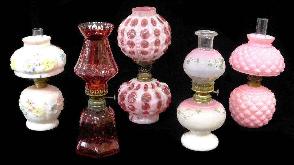 Appraisal: Miniature oil lamps all with pink red or white glass