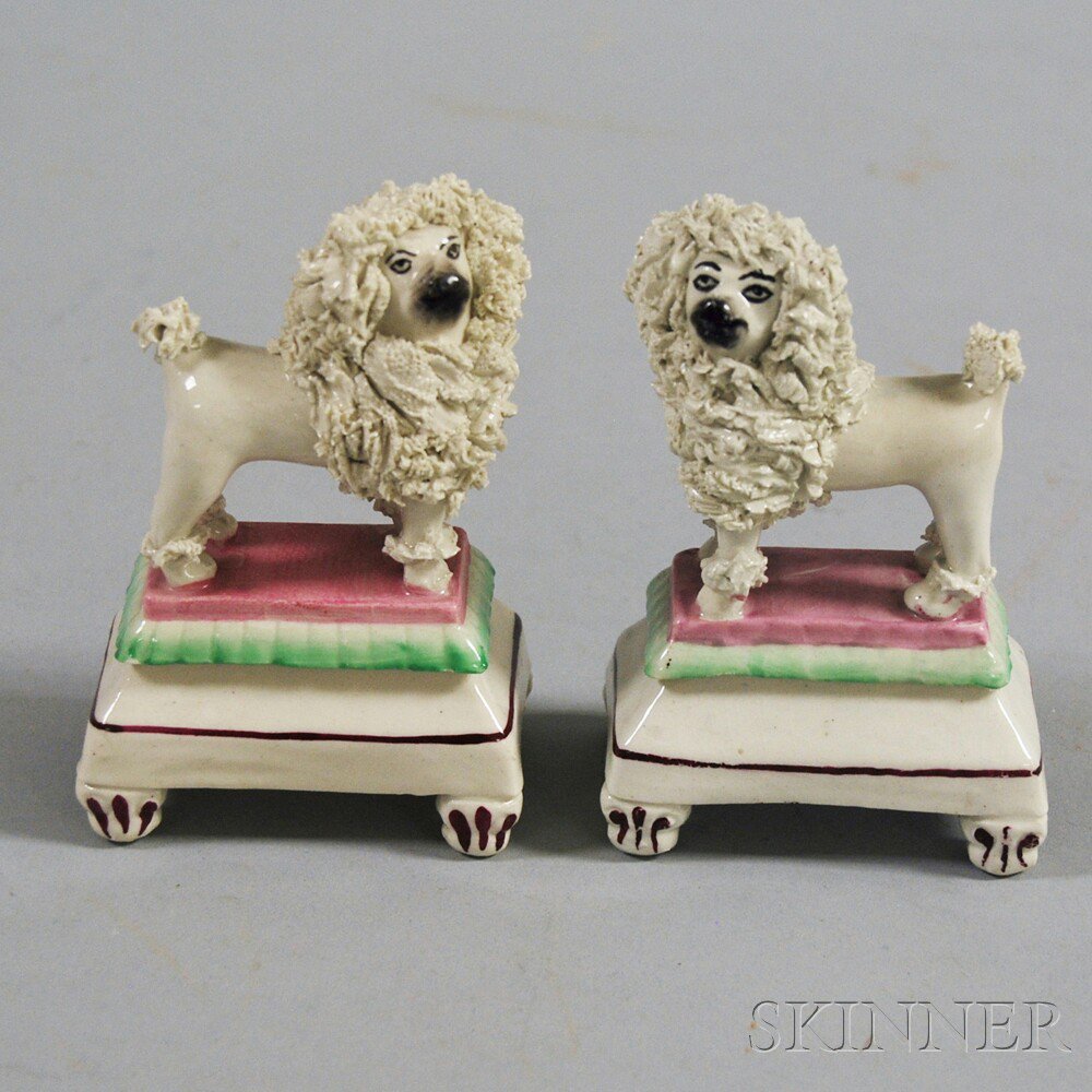 Appraisal: Pair of Porcelain Staffordshire Spaniels th century ht in Estimate