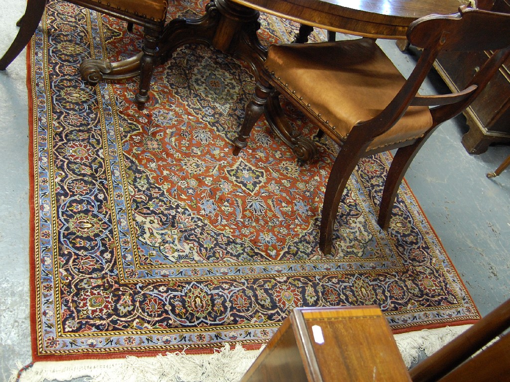 Appraisal: Persian red ground floral design rug with multiborder