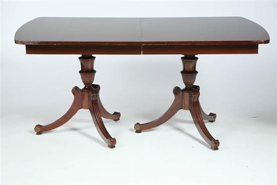 Appraisal: DINING TABLE Rounded rectangular mahogany table on double pedastals h