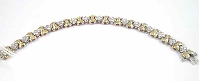 Appraisal: DIAMOND AND FOURTEEN KARAT GOLD BRACELET The white and gold