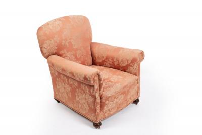 Appraisal: An upholstered armchair with rocking mechanism to the base