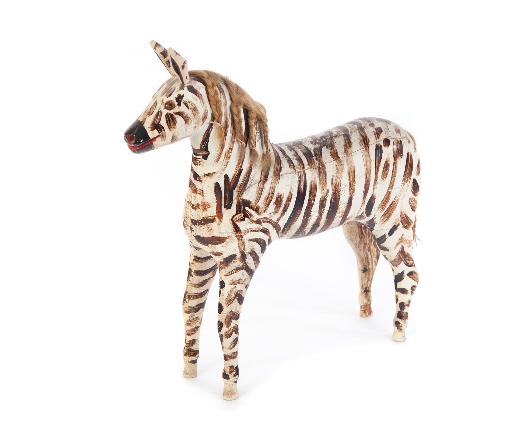 Appraisal: FOLKSY AMERICAN CARVED ZEBRA Late th-early th century Standing zebra