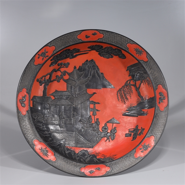 Appraisal: Chinese red and black glazed porcelain charger with courtyard scenes