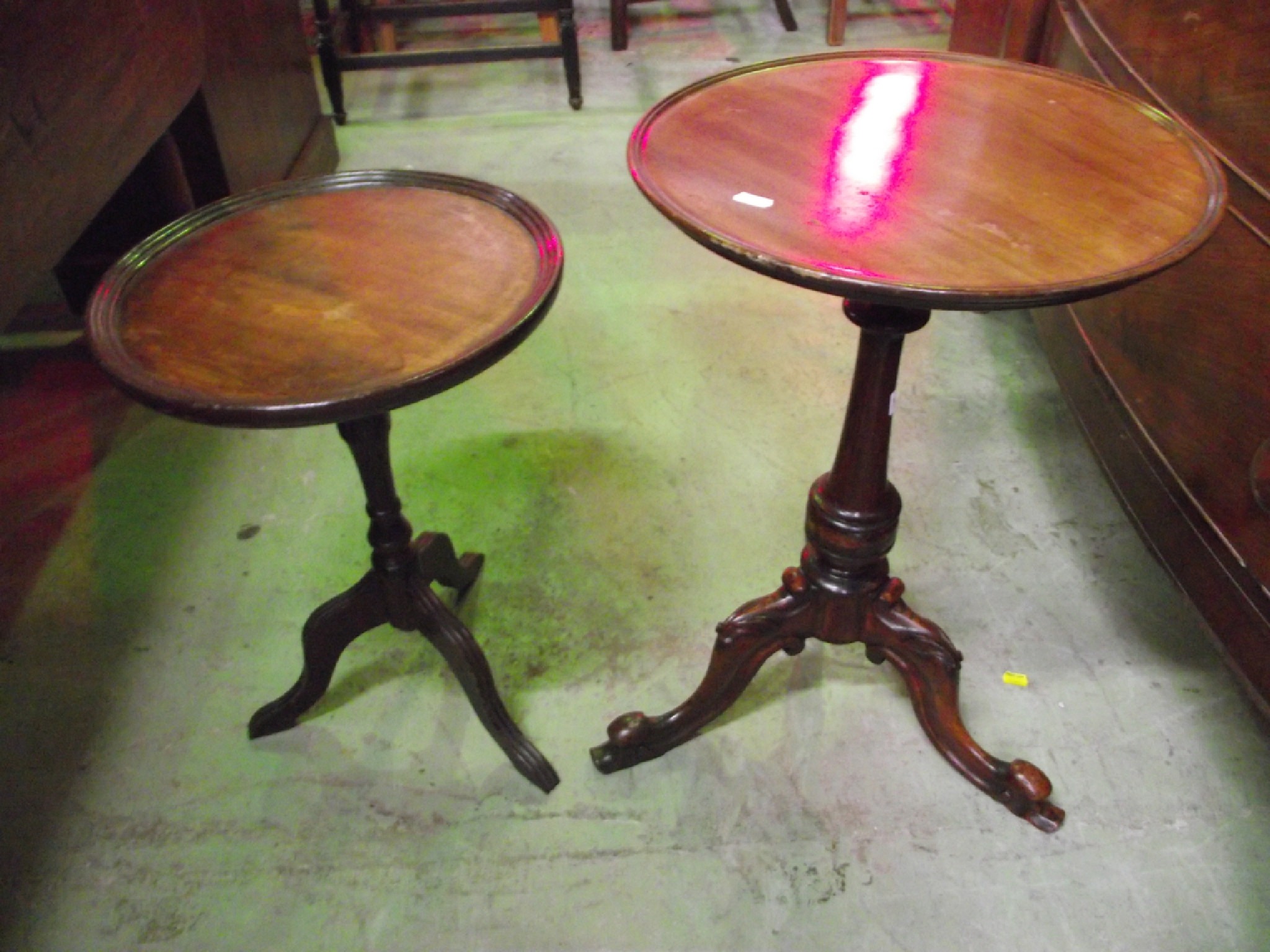 Appraisal: A mahogany occasional table the circular tray top raised on