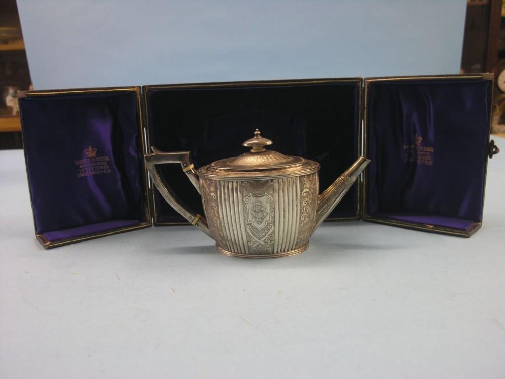 Appraisal: A Victorian Mappin Webb silver bachelor teapot oval-shape with engraved